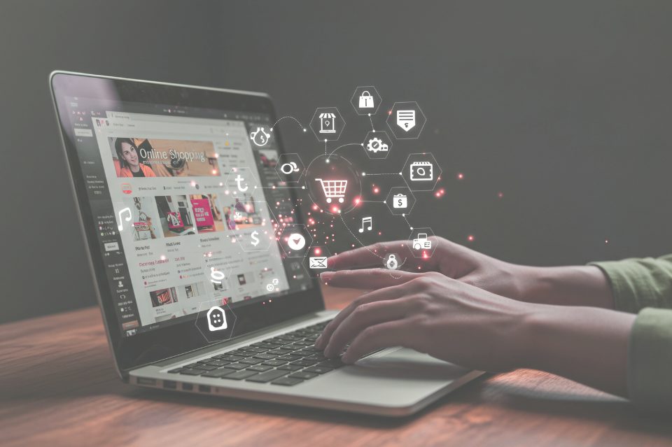 Laptop screen surrounded by website and media icons